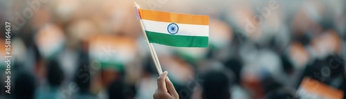People of all ages dressed in saffron, white, and green, participating in a unity walk through the streets, waving flags and singing patriotic songs