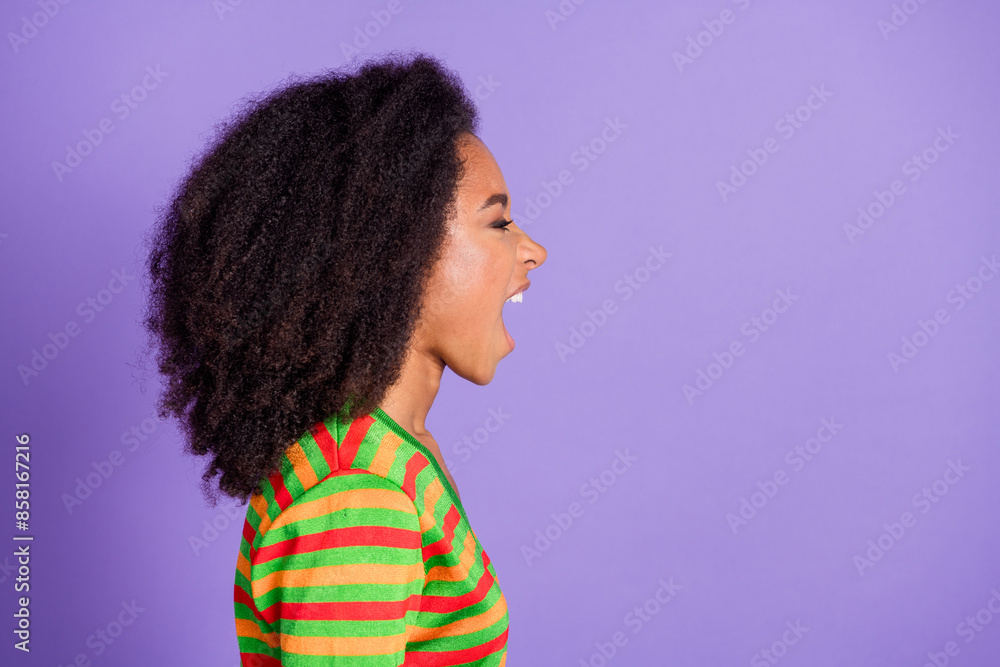 Photo of angry furious lady dressed striped cardigan screaming empty space isolated violet color background Photo of angry furious lady dressed striped cardigan screaming empty space isolated violet color background