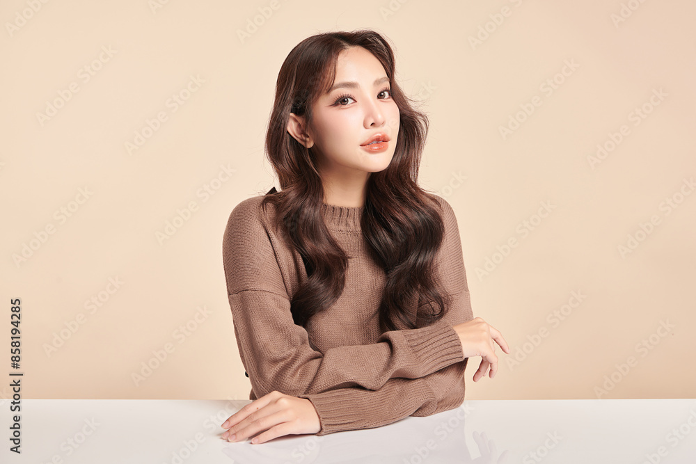 Naklejka premium Beautiful young asian woman with clean fresh skin on beige background, Face care, Facial treatment, Cosmetology, beauty and spa, Asian women portrait.