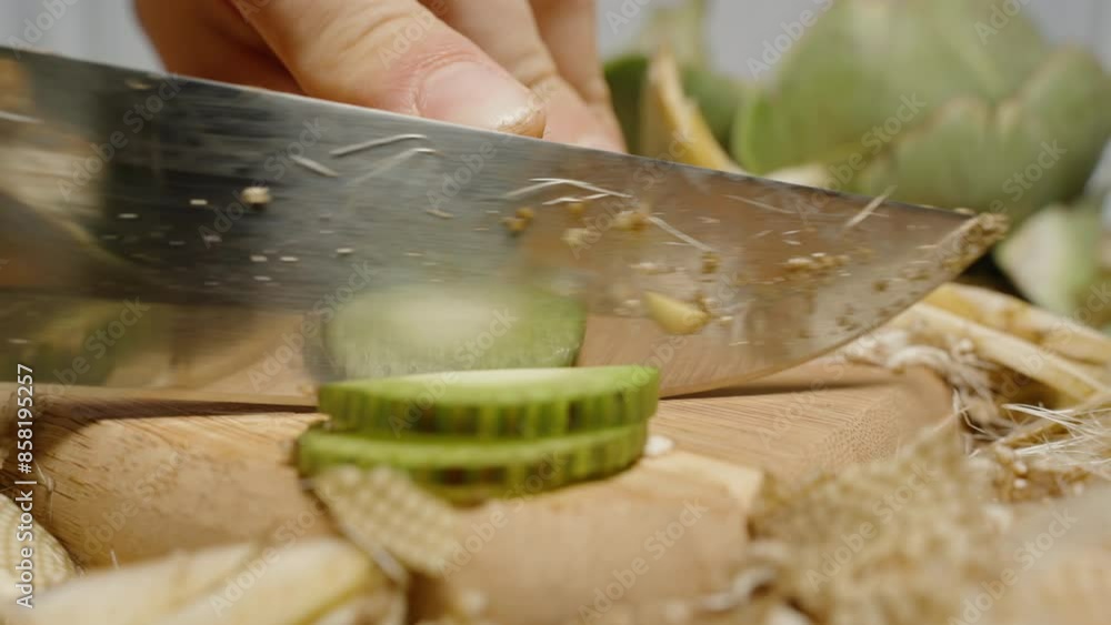 Green Stem of an Artichoke Cut into Slices, Close-Up. Green Stem of an Artichoke Cut into Slices, Close-Up.