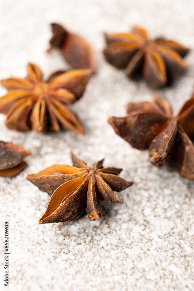 Spice star anise closeup on gray stone background Spice star anise closeup on gray stone background