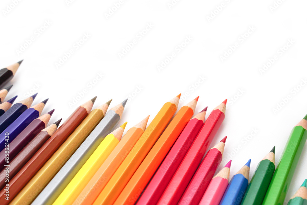 Fototapeta premium Selective focus, Top view of colored pencils or pastel on white background. Learning, study and presentation concept.