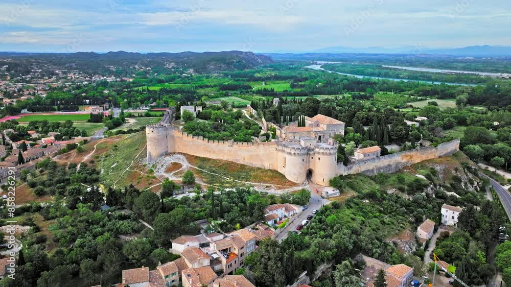 Aerial view of a Cultural landmark fortress on a hill in Avignon, France. French castle with gardens, walking paths, mountain and city views. Aerial view of a Cultural landmark fortress on a hill in Avignon, France. French castle with gardens, walking paths, mountain and city views.