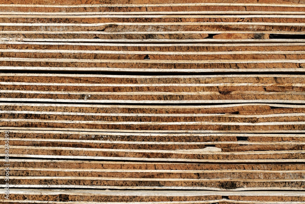 Plywood Background: Weathered Cross Section of Piled Plywood Panels - Detail Plywood Background: Weathered Cross Section of Piled Plywood Panels - Detail