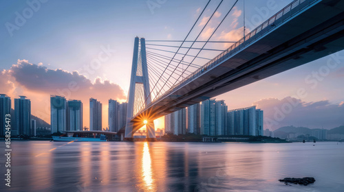 Modern cable-stayed bridge with a cityscape in the background