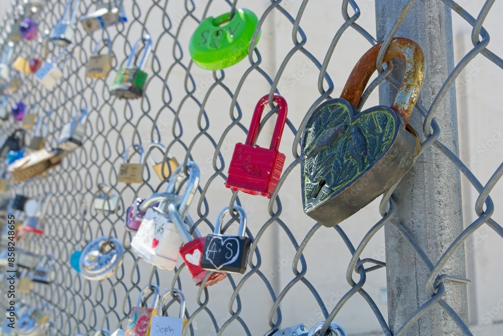 Love locks on chain link fence. Love locks on chain link fence.
