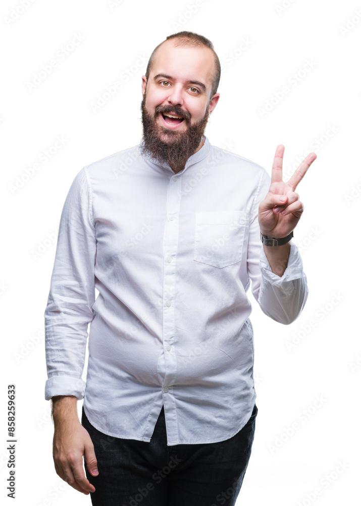 Young caucasian hipster man over isolated background smiling with happy face winking at the camera doing victory sign. Number two. Young caucasian hipster man over isolated background smiling with happy face winking at the camera doing victory sign. Number two.