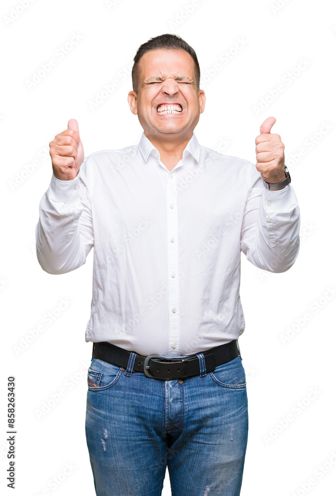 Middle age arab elegant man over isolated background excited for success with arms raised celebrating victory smiling. Winner concept. Middle age arab elegant man over isolated background excited for success with arms raised celebrating victory smiling. Winner concept.