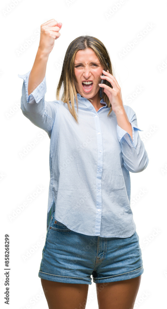 Young beautiful woman talking on smartphone over isolated background annoyed and frustrated shouting with anger, crazy and yelling with raised hand, anger concept Young beautiful woman talking on smartphone over isolated background annoyed and frustrated shouting with anger, crazy and yelling with raised hand, anger concept