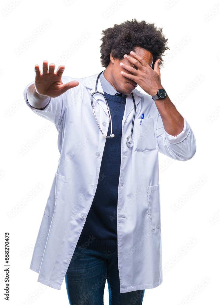 Afro american doctor man over isolated background covering eyes with hands and doing stop gesture with sad and fear expression. Embarrassed and negative concept. Afro american doctor man over isolated background covering eyes with hands and doing stop gesture with sad and fear expression. Embarrassed and negative concept.