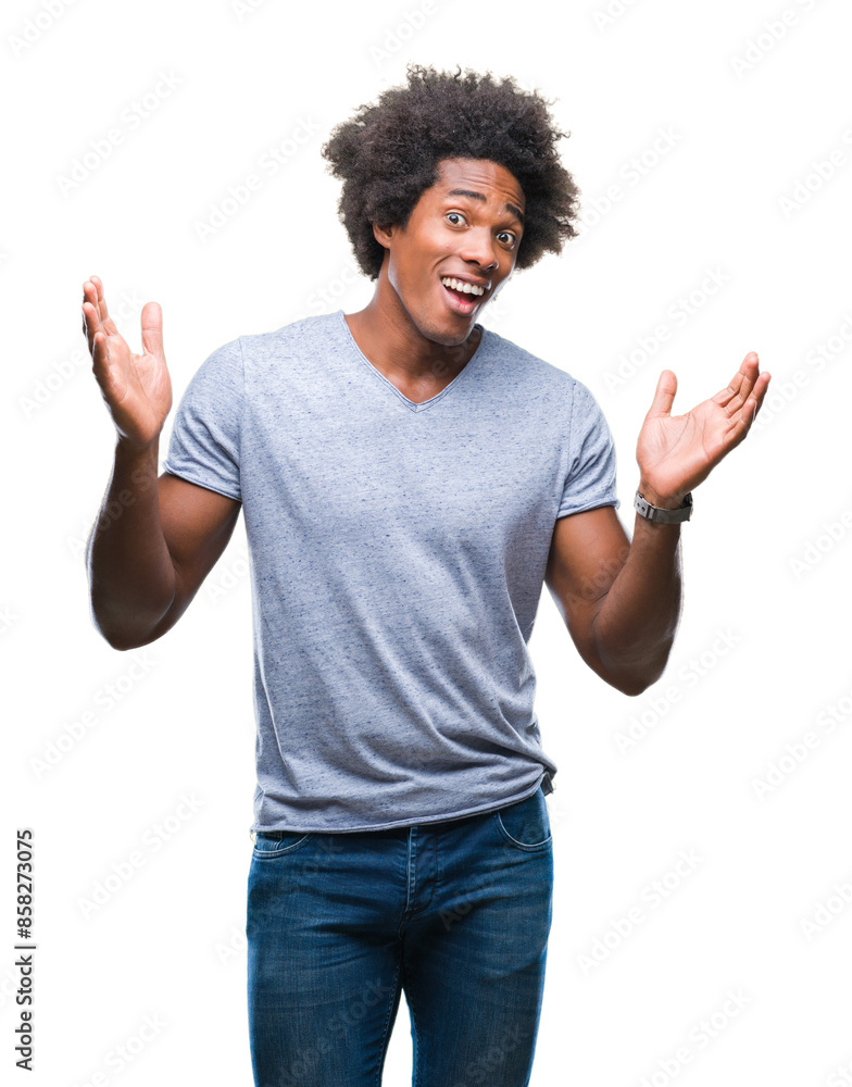Afro american man over isolated background clueless and confused expression with arms and hands raised. Doubt concept. Afro american man over isolated background clueless and confused expression with arms and hands raised. Doubt concept.