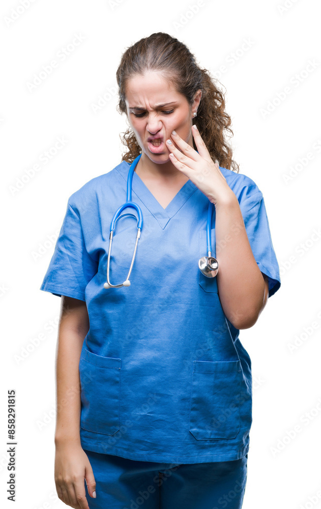 Young brunette doctor girl wearing nurse or surgeon uniform over isolated background touching mouth with hand with painful expression because of toothache or dental illness on teeth. Dentist concept. Young brunette doctor girl wearing nurse or surgeon uniform over isolated background touching mouth with hand with painful expression because of toothache or dental illness on teeth. Dentist concept.