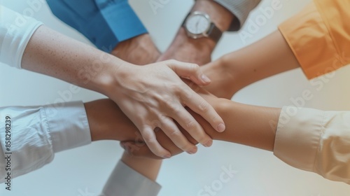 Close Up Top View Of Business People Putting Their Hands Together: Stack Of Hands Signifying Unity, Teamwork, And Support.