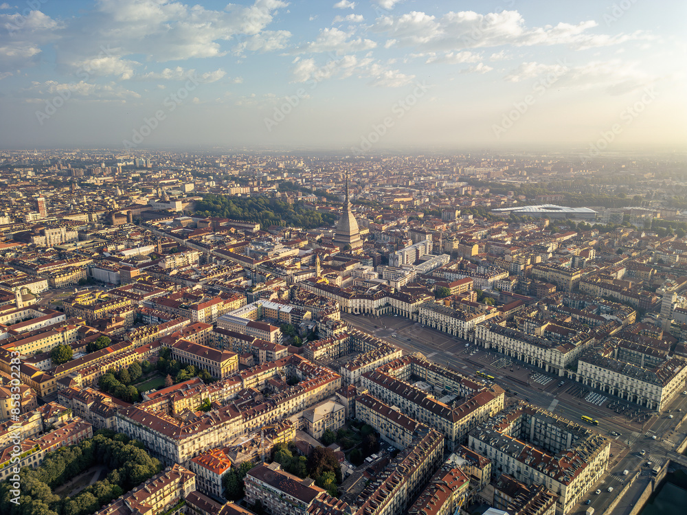The drone aerial view of Turin city centre with Mole Antonelliana at sunrise, Piedmont region of Italy. The drone aerial view of Turin city centre with Mole Antonelliana at sunrise, Piedmont region of Italy.