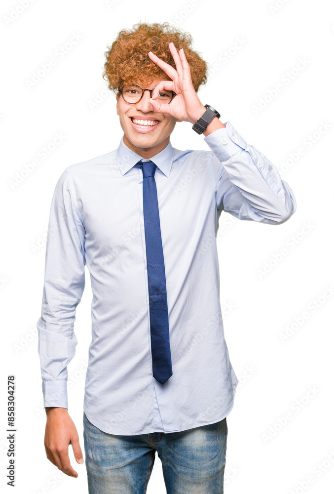 Young handsome business man with afro wearing glasses doing ok gesture with hand smiling, eye looking through fingers with happy face. Young handsome business man with afro wearing glasses doing ok gesture with hand smiling, eye looking through fingers with happy face.