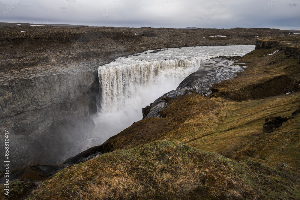 Fototapeta premium Dettifoss waterfall on iceland under a dramatic sky in summer