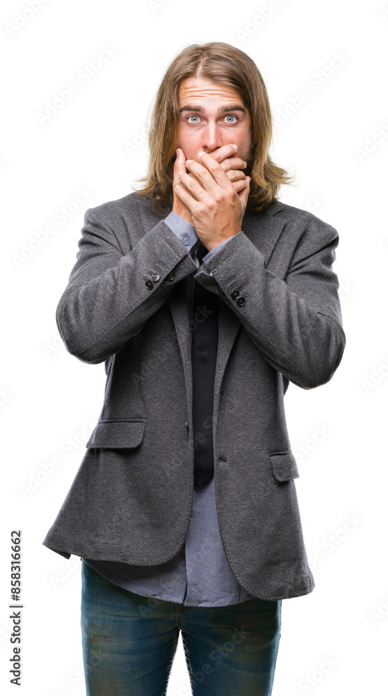 Young handsome business man with long hair over isolated background shocked covering mouth with hands for mistake. Secret concept. Young handsome business man with long hair over isolated background shocked covering mouth with hands for mistake. Secret concept.