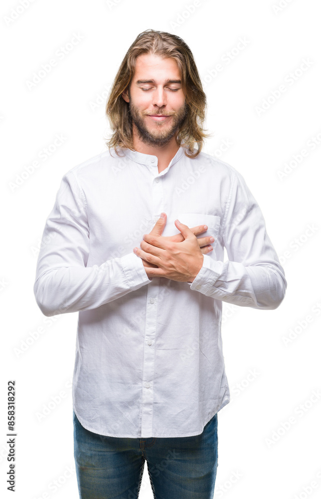 Young handsome man with long hair over isolated background smiling with hands on chest with closed eyes and grateful gesture on face. Health concept. Young handsome man with long hair over isolated background smiling with hands on chest with closed eyes and grateful gesture on face. Health concept.
