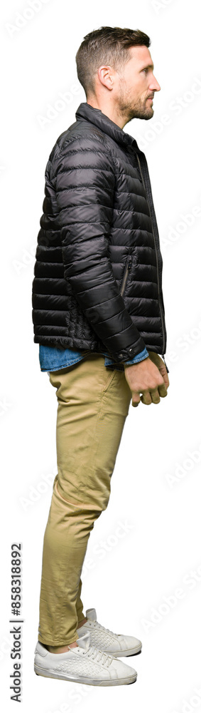 Handsome man wearing winter coat looking to side, relax profile pose with natural face with confident smile. Handsome man wearing winter coat looking to side, relax profile pose with natural face with confident smile.