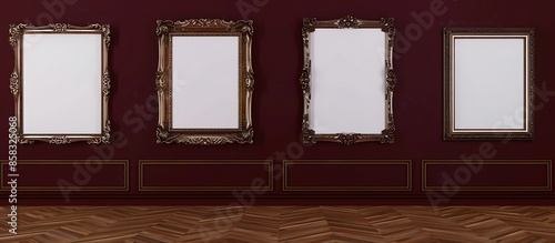 Four empty, ornate picture frames of varying shapes, against a deep burgundy wall in a luxurious art gallery, with an espresso wooden floor.