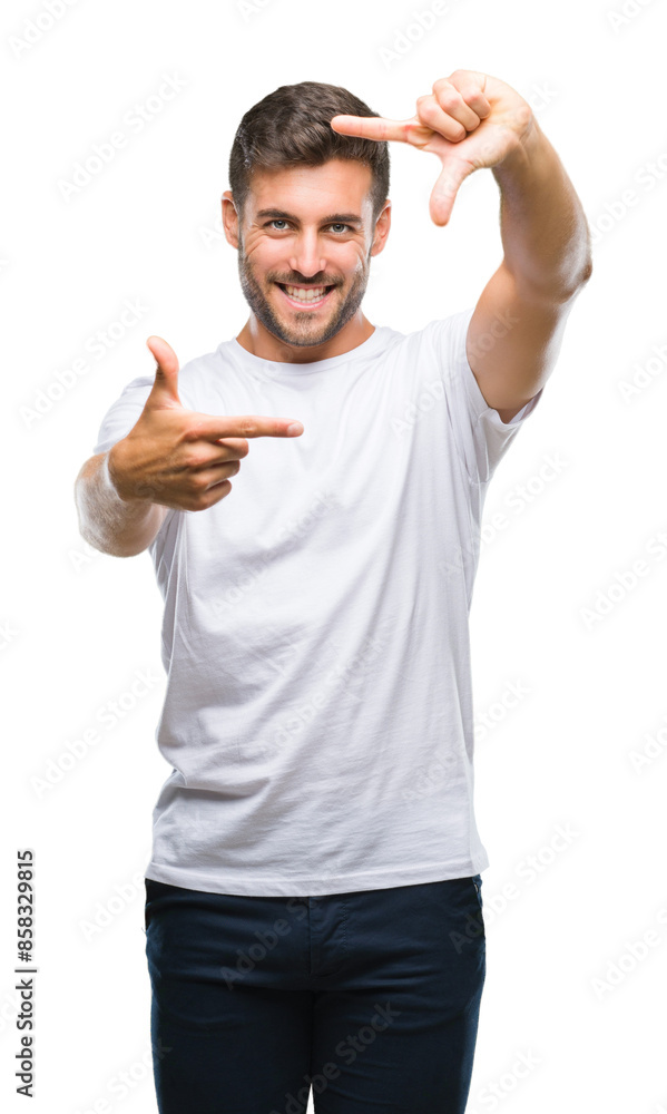 Fototapeta premium Young handsome man over isolated background smiling making frame with hands and fingers with happy face. Creativity and photography concept.
