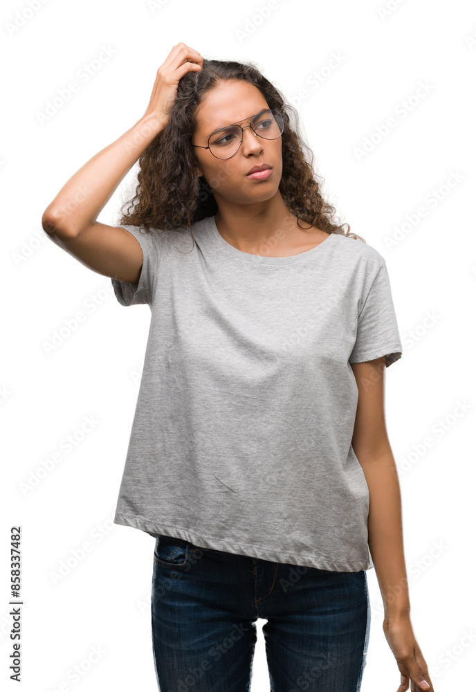 Fototapeta premium Beautiful young hispanic woman wearing glasses confuse and wonder about question. Uncertain with doubt, thinking with hand on head. Pensive concept.