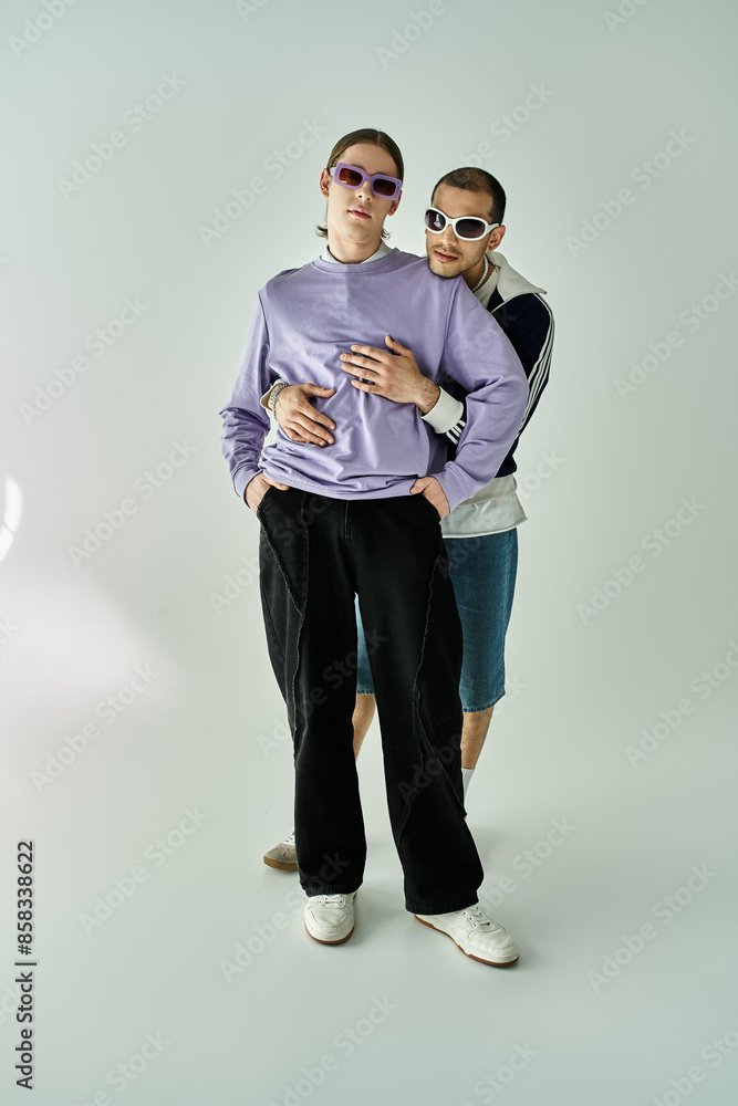 A couple of men sharing a moment, standing side by side. A couple of men sharing a moment, standing side by side.