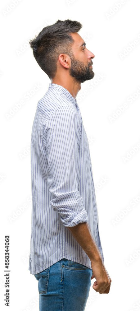 Adult hispanic man over isolated background looking to side, relax profile pose with natural face with confident smile. Adult hispanic man over isolated background looking to side, relax profile pose with natural face with confident smile.