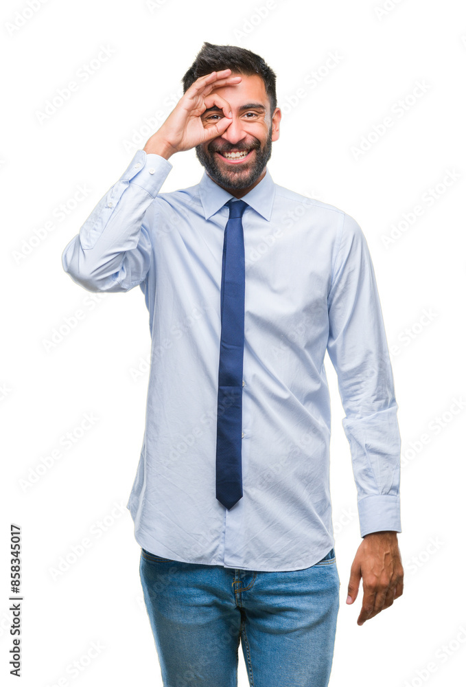 Adult hispanic business man over isolated background doing ok gesture with hand smiling, eye looking through fingers with happy face. Adult hispanic business man over isolated background doing ok gesture with hand smiling, eye looking through fingers with happy face.