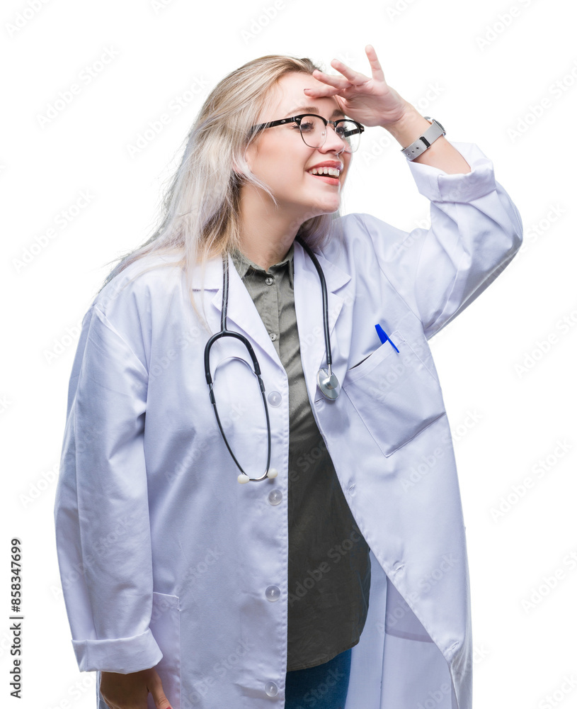 Young blonde doctor woman over isolated background very happy and smiling looking far away with hand over head. Searching concept. Young blonde doctor woman over isolated background very happy and smiling looking far away with hand over head. Searching concept.