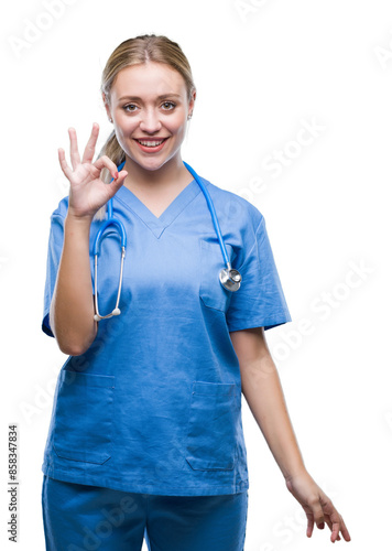 Young blonde surgeon doctor woman over isolated background smiling positive doing ok sign with hand and fingers. Successful expression. © Krakenimages.com