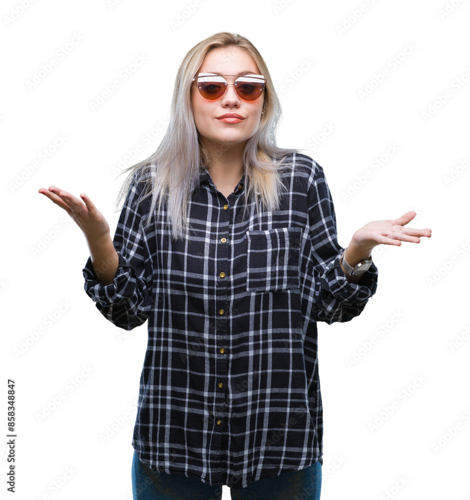 Young blonde woman wearing sunglasses over isolated background clueless and confused expression with arms and hands raised. Doubt concept. Young blonde woman wearing sunglasses over isolated background clueless and confused expression with arms and hands raised. Doubt concept.