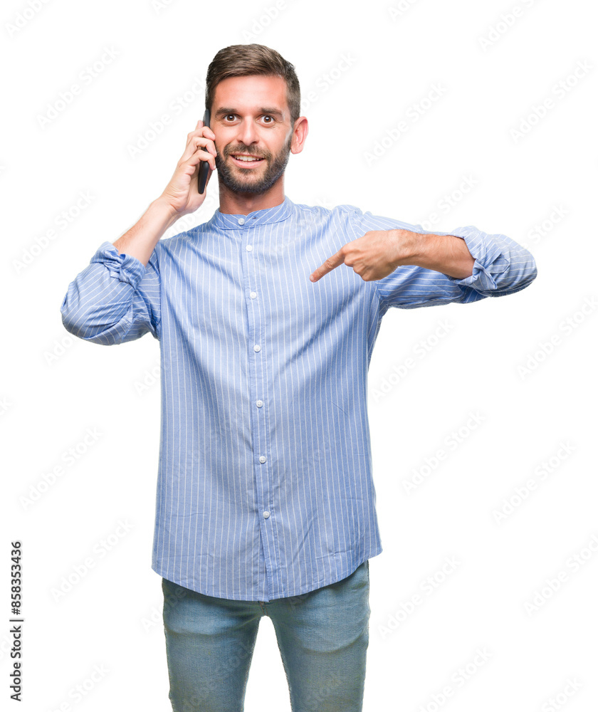 Young handsome man speaking on the phone over isolated background with surprise face pointing finger to himself Young handsome man speaking on the phone over isolated background with surprise face pointing finger to himself