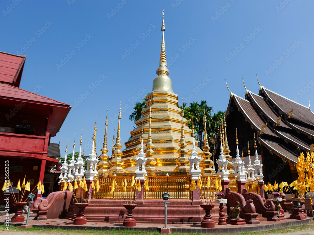 Fototapeta premium Golden stupa at Wat Phan Tao, Chiang Mai, Thailand, a serene Buddhist temple.