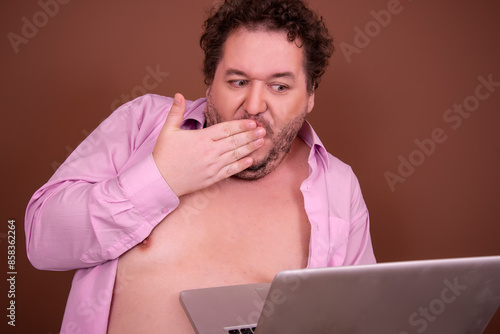 Funny fat man and online dating. Brown background.