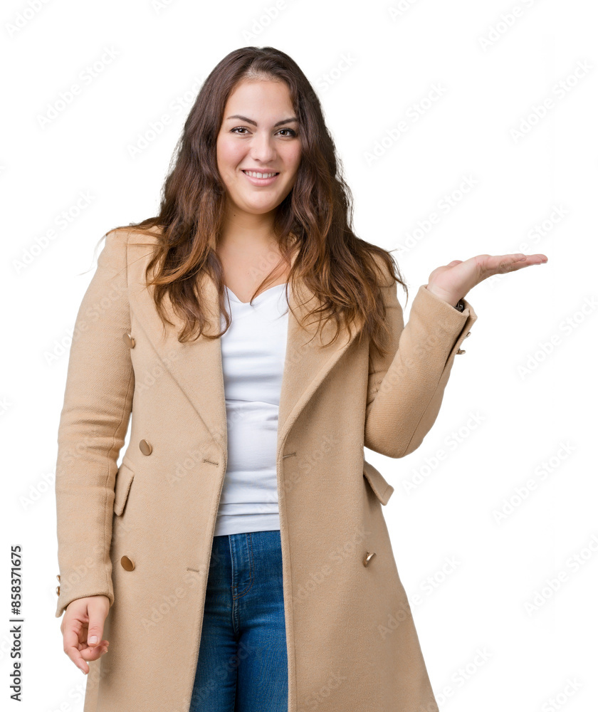 Beautiful plus size young woman wearing winter coat over isolated background smiling cheerful presenting and pointing with palm of hand looking at the camera. Beautiful plus size young woman wearing winter coat over isolated background smiling cheerful presenting and pointing with palm of hand looking at the camera.