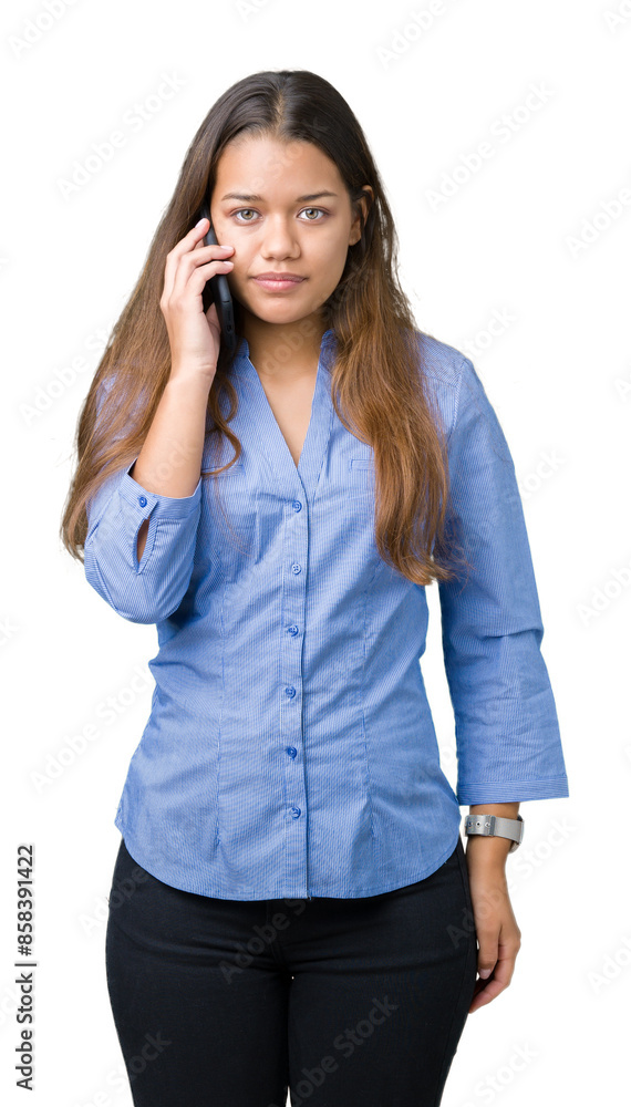 Young beautiful brunette business woman talking on smartphone over isolated background with a confident expression on smart face thinking serious Young beautiful brunette business woman talking on smartphone over isolated background with a confident expression on smart face thinking serious