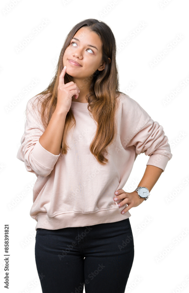 Young beautiful brunette woman wearing pink sweatshirt over isolated background with hand on chin thinking about question, pensive expression. Smiling with thoughtful face. Doubt concept. Young beautiful brunette woman wearing pink sweatshirt over isolated background with hand on chin thinking about question, pensive expression. Smiling with thoughtful face. Doubt concept.