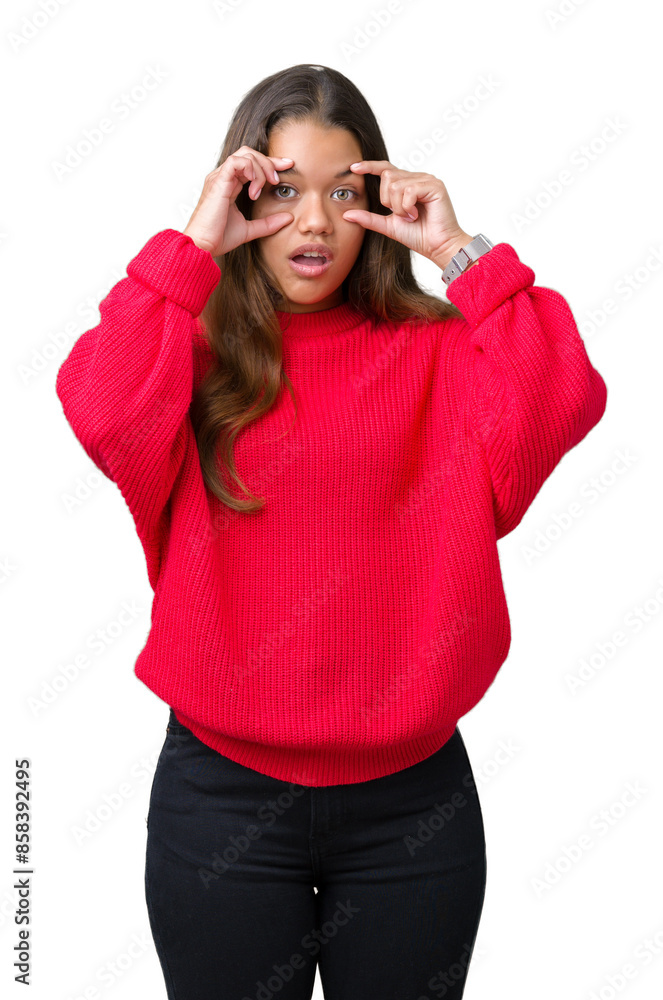 Young beautiful brunette woman wearing red winter sweater over isolated background Trying to open eyes with fingers, sleepy and tired for morning fatigue Young beautiful brunette woman wearing red winter sweater over isolated background Trying to open eyes with fingers, sleepy and tired for morning fatigue
