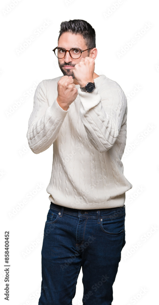 Young handsome man wearing glasses over isolated background Ready to fight with fist defense gesture, angry and upset face, afraid of problem Young handsome man wearing glasses over isolated background Ready to fight with fist defense gesture, angry and upset face, afraid of problem