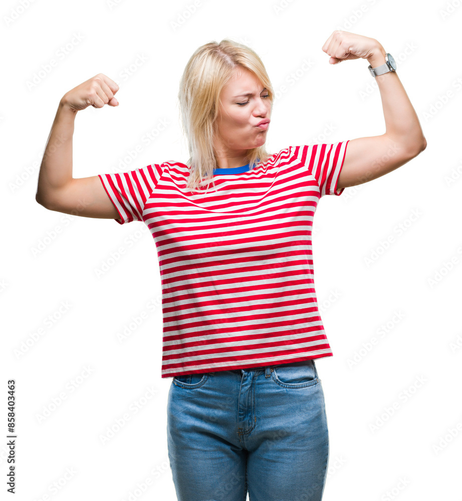 Young beautiful blonde woman over isolated background showing arms muscles smiling proud. Fitness concept. Young beautiful blonde woman over isolated background showing arms muscles smiling proud. Fitness concept.