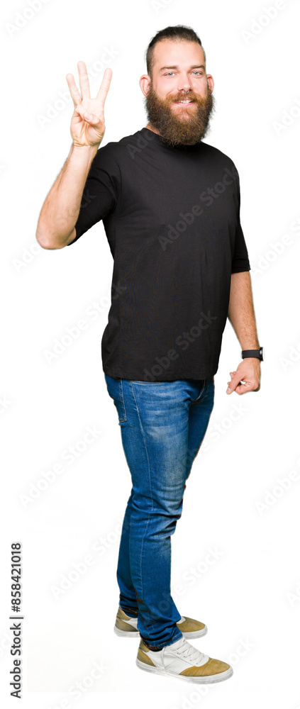 Young blond man wearing casual t-shirt showing and pointing up with fingers number three while smiling confident and happy. Young blond man wearing casual t-shirt showing and pointing up with fingers number three while smiling confident and happy.