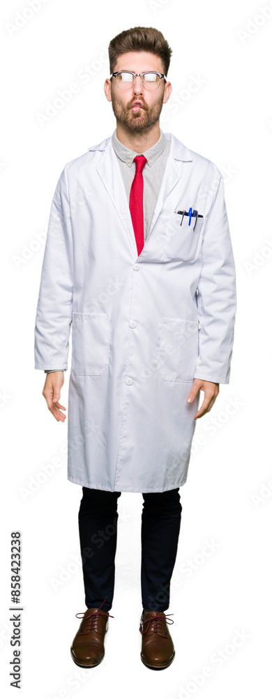 Young handsome scientist man wearing glasses making fish face with lips, crazy and comical gesture. Funny expression. Young handsome scientist man wearing glasses making fish face with lips, crazy and comical gesture. Funny expression.