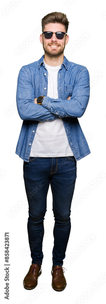 Young handsome elegant man wearing denim jacket happy face smiling with crossed arms looking at the camera. Positive person. Young handsome elegant man wearing denim jacket happy face smiling with crossed arms looking at the camera. Positive person.