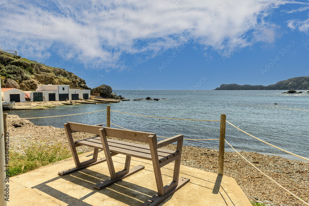 Fototapeta premium Tranquil Bench Overlooking Cala des Murtar, Menorca