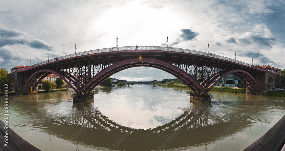 The Old bridge in Maribor city with the river Drava. A panorama view The Old bridge in Maribor city with the river Drava. A panorama view