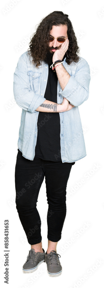 Young hipster man with long hair and beard wearing sunglasses thinking looking tired and bored with depression problems with crossed arms. Young hipster man with long hair and beard wearing sunglasses thinking looking tired and bored with depression problems with crossed arms.