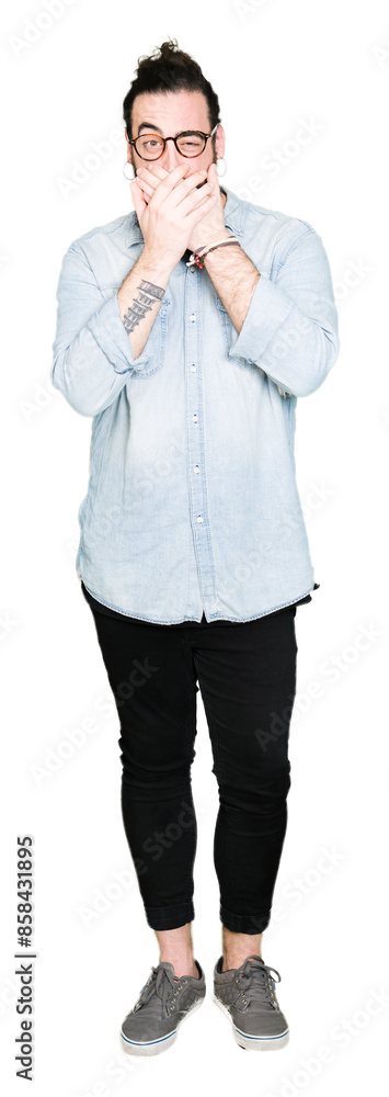 Young hipster man with long hair and beard wearing glasses shocked covering mouth with hands for mistake. Secret concept. Young hipster man with long hair and beard wearing glasses shocked covering mouth with hands for mistake. Secret concept.