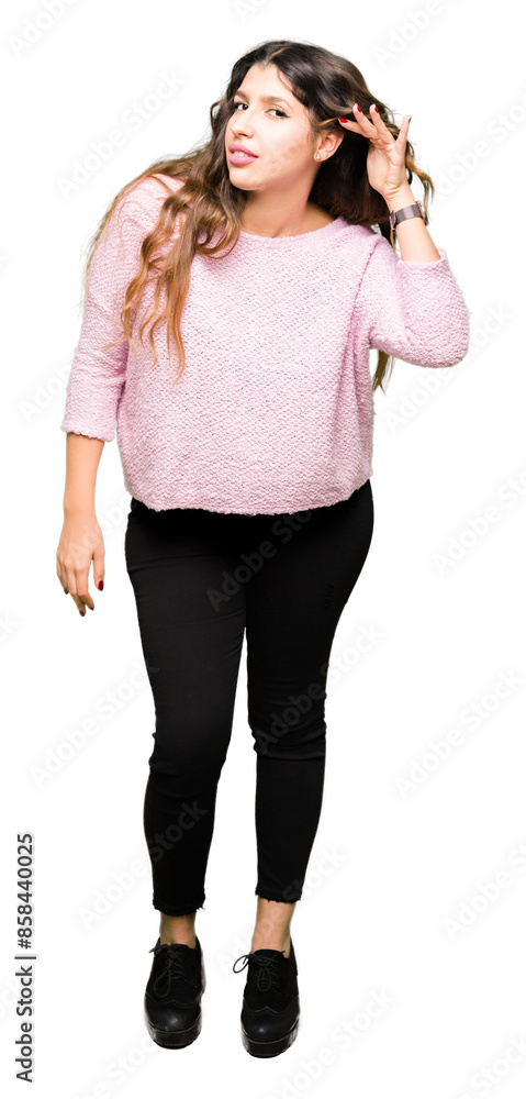 Young beautiful woman wearing pink sweater smiling with hand over ear listening an hearing to rumor or gossip. Deafness concept. Young beautiful woman wearing pink sweater smiling with hand over ear listening an hearing to rumor or gossip. Deafness concept.