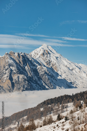 Wallpaper Mural Snowy mountain peak above cloud-covered valley Torontodigital.ca